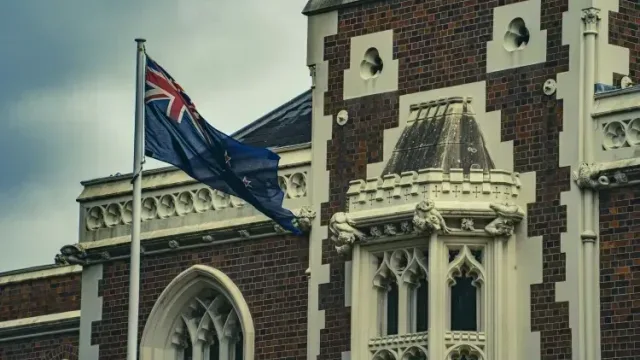 New Zealand's central bank holds rate at 2.25% but signals aggressive future hikes